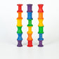 Wooden rainbow spools stacked in three columns