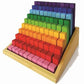 Coloured wooden block set in stepped increments and rainbow colours.